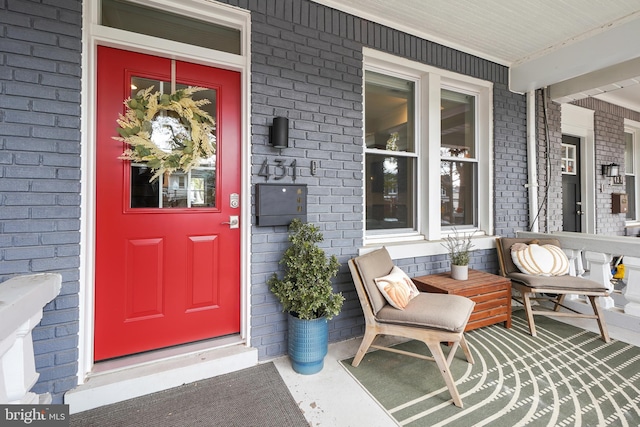 entrance to property featuring a porch