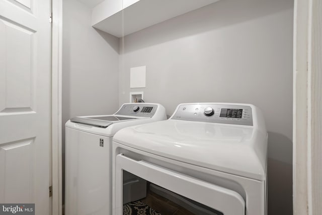 washroom featuring separate washer and dryer