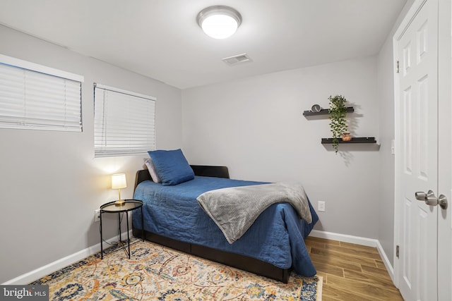 bedroom featuring hardwood / wood-style floors