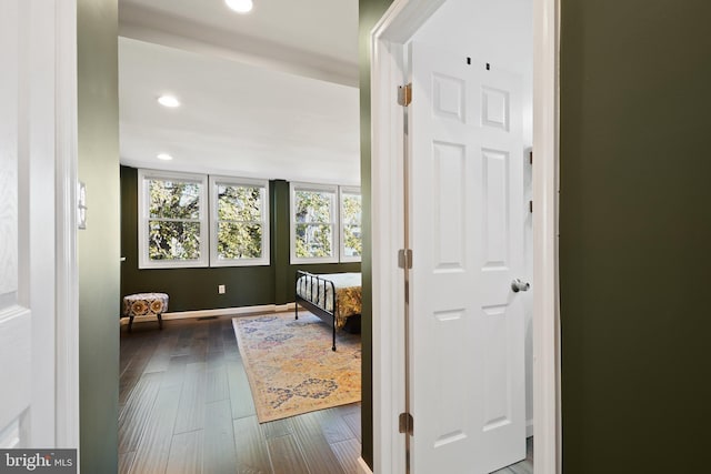 corridor with dark wood-type flooring