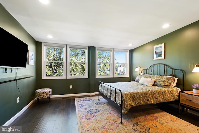 bedroom featuring dark hardwood / wood-style flooring