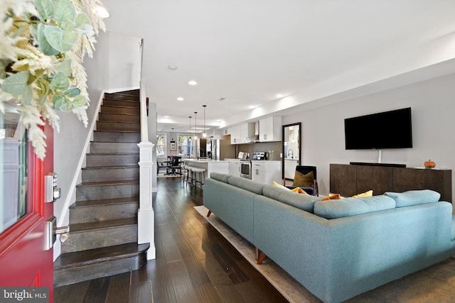 living room featuring dark wood-type flooring