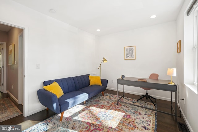 office space with dark hardwood / wood-style flooring