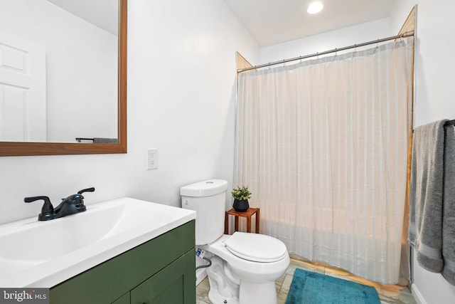 full bathroom featuring vanity, shower / bath combination with curtain, and toilet