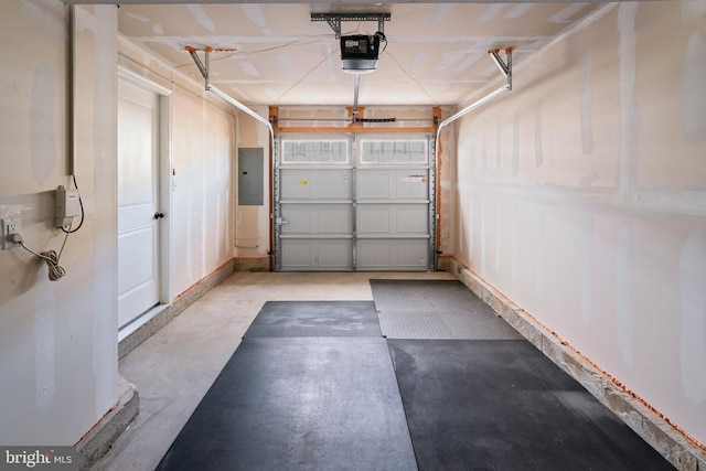 garage with electric panel and a garage door opener