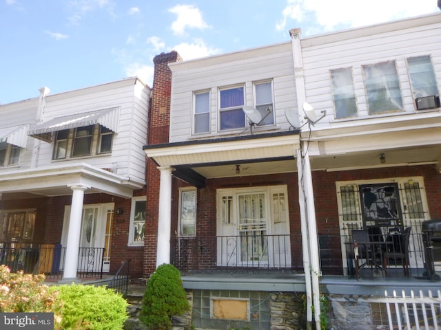 townhome / multi-family property with covered porch