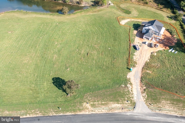 birds eye view of property featuring a rural view and a water view