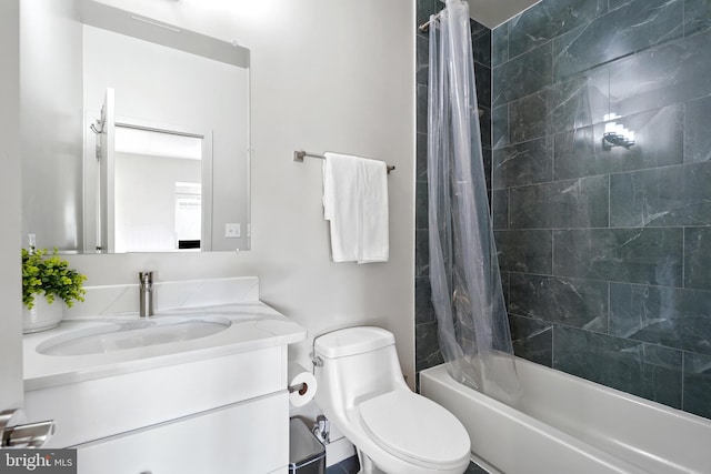 bathroom with vanity, toilet, and shower / bath combination with curtain