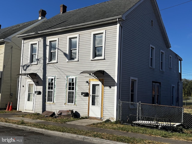 multi unit property featuring a chimney