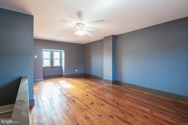 unfurnished room with ceiling fan and light wood-type flooring