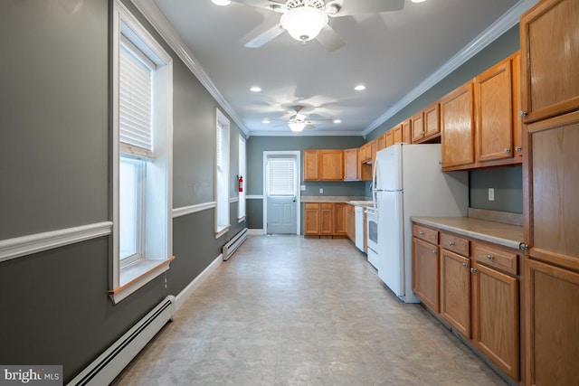 kitchen featuring plenty of natural light, crown molding, and a baseboard heating unit