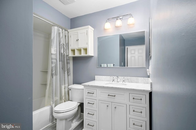 full bathroom featuring shower / bath combo, toilet, and vanity