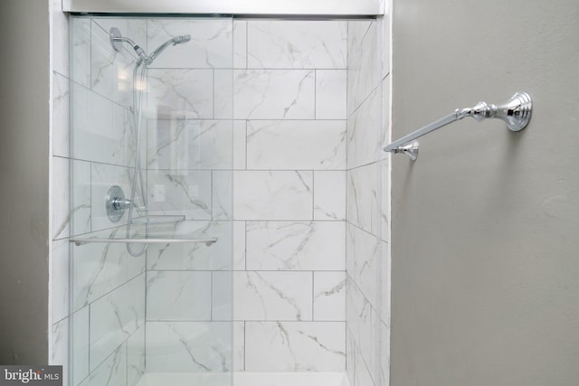 bathroom with tiled shower