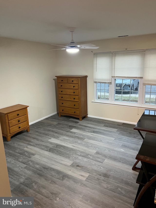 bedroom featuring wood-type flooring and ceiling fan