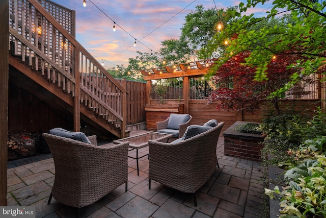 view of patio terrace at dusk