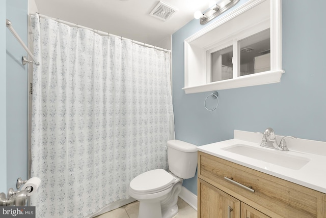 bathroom featuring toilet, vanity, and tile patterned floors