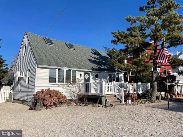 view of front of house featuring a wooden deck