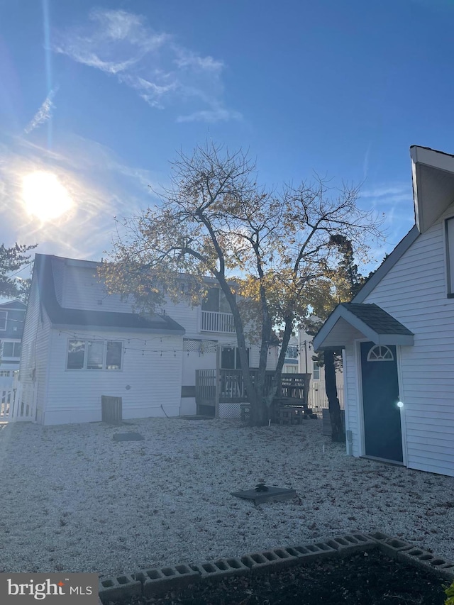 view of property exterior featuring cooling unit and a deck