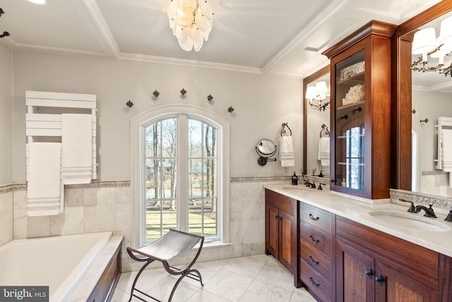 bathroom with a garden tub, tile patterned flooring, tile walls, and a sink