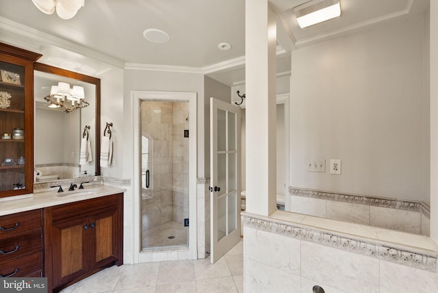 bathroom with a stall shower, tile patterned flooring, vanity, and crown molding