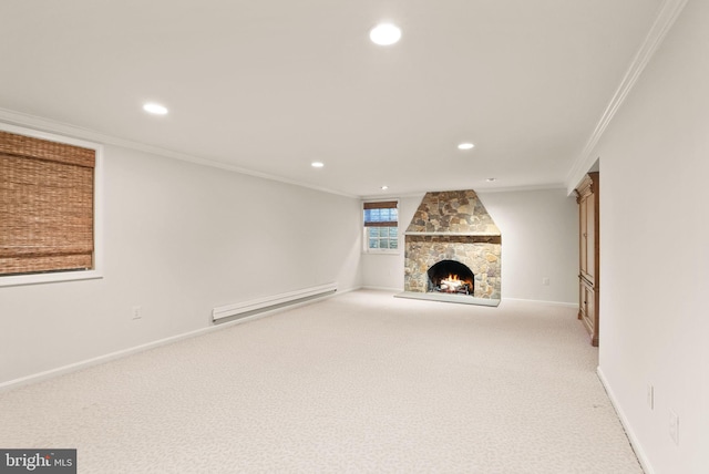 unfurnished living room featuring carpet floors, a fireplace, crown molding, baseboard heating, and baseboards