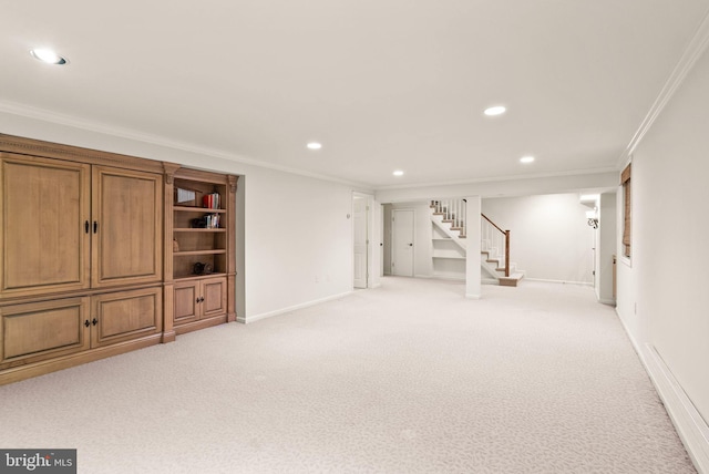 finished basement with light carpet, baseboards, stairway, ornamental molding, and recessed lighting