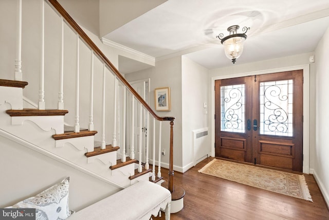 entrance foyer with french doors, stairway, wood finished floors, and baseboards