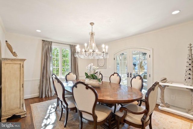 dining space featuring french doors, recessed lighting, wood finished floors, and crown molding