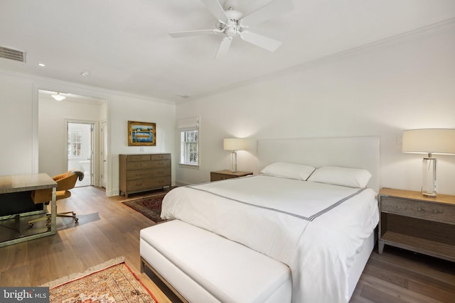 bedroom with ceiling fan, hardwood / wood-style flooring, and ornamental molding