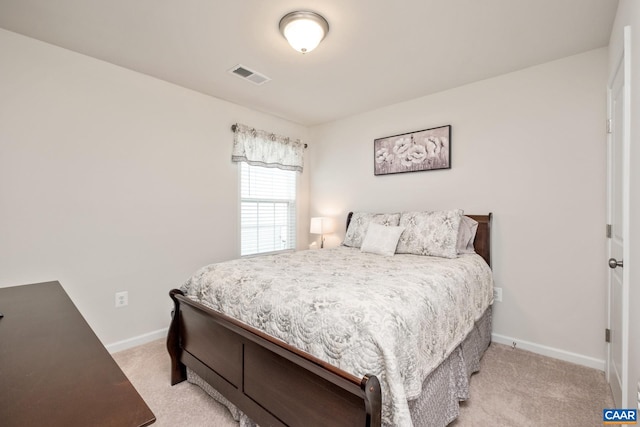 bedroom featuring light carpet