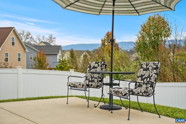 view of patio / terrace featuring a mountain view