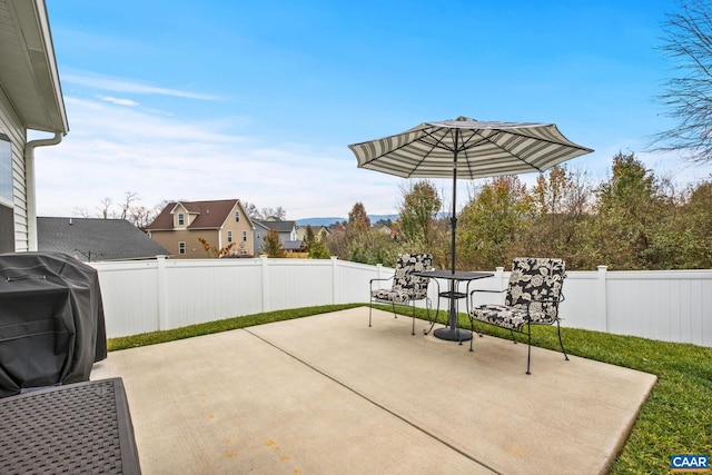 view of patio with a grill