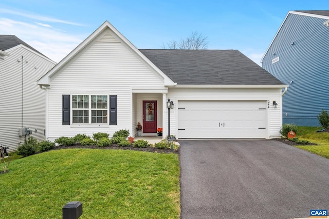 single story home with a front yard and a garage