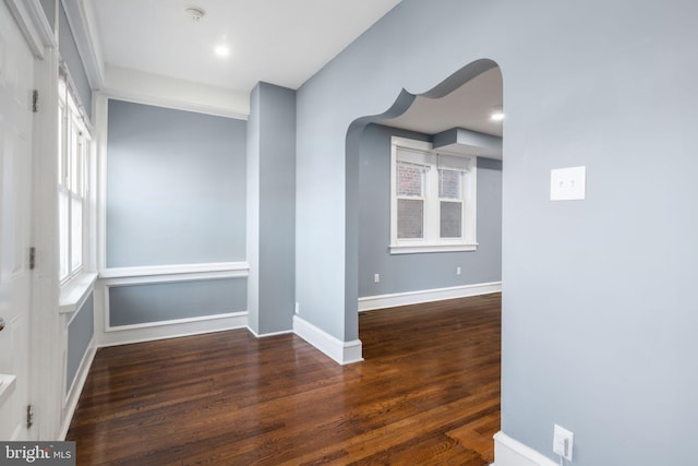 spare room featuring dark wood-type flooring