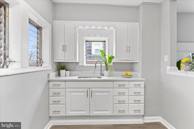 kitchen with white cabinets and sink