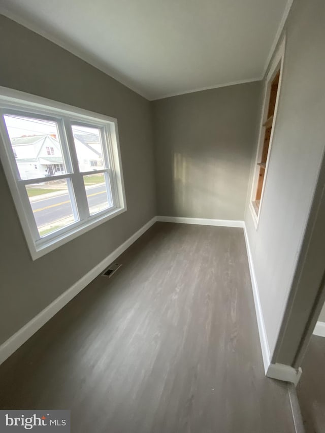 unfurnished room featuring wood-type flooring