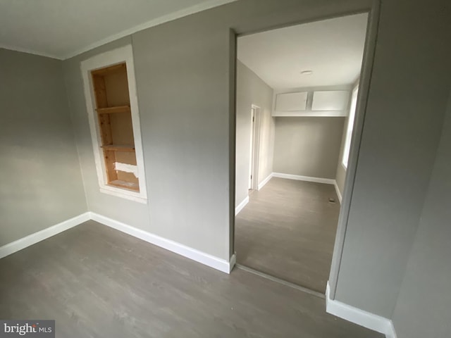 corridor featuring dark wood-type flooring