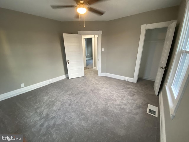 unfurnished bedroom with carpet flooring, a closet, and ceiling fan