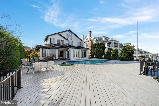 66 Pelican Dr, Avalon, NJ 08202 - view of pool featuring outdoor dining area, a pool with connected hot tub, a wooden deck, and a patio