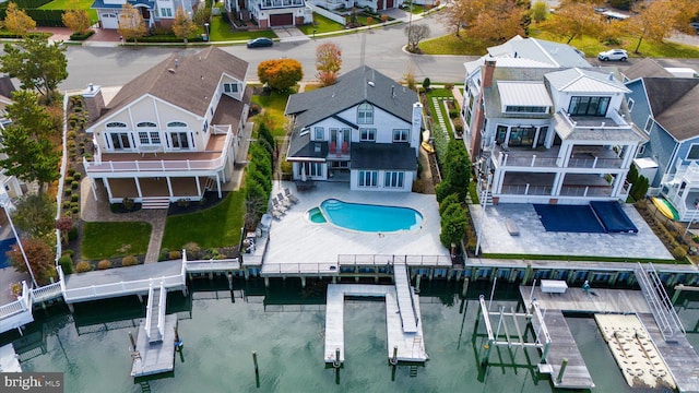 66 Pelican Dr, Avalon, NJ 08202 - aerial view of residential area featuring a nearby body of water and a pool area
