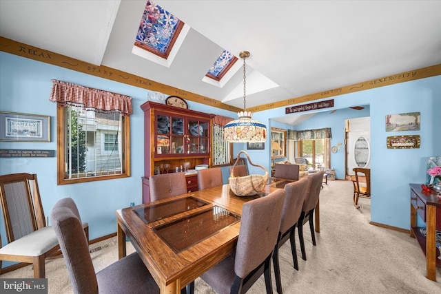 66 Pelican Dr, Avalon, NJ 08202 - dining area featuring a skylight, light carpet, vaulted ceiling, and baseboards