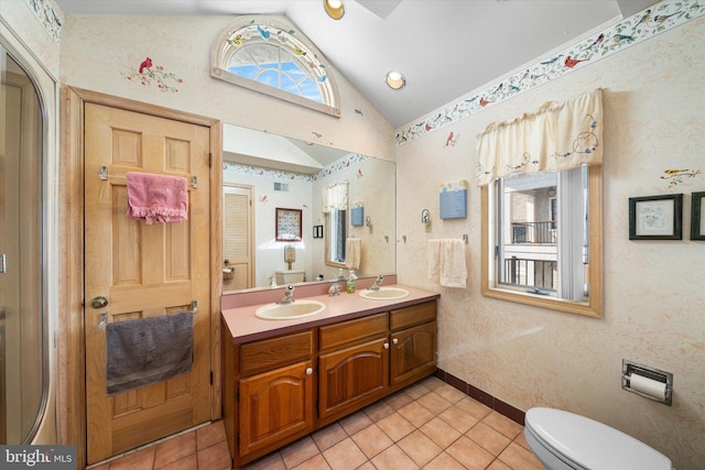 66 Pelican Dr, Avalon, NJ 08202 - bathroom featuring lofted ceiling, tile patterned floors, toilet, double vanity, and baseboards
