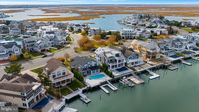 66 Pelican Dr, Avalon, NJ 08202 - aerial view of residential area featuring a large body of water and a marina