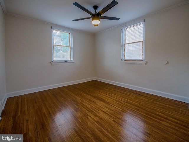 empty room featuring a ceiling fan, crown molding, baseboards, and wood finished floors