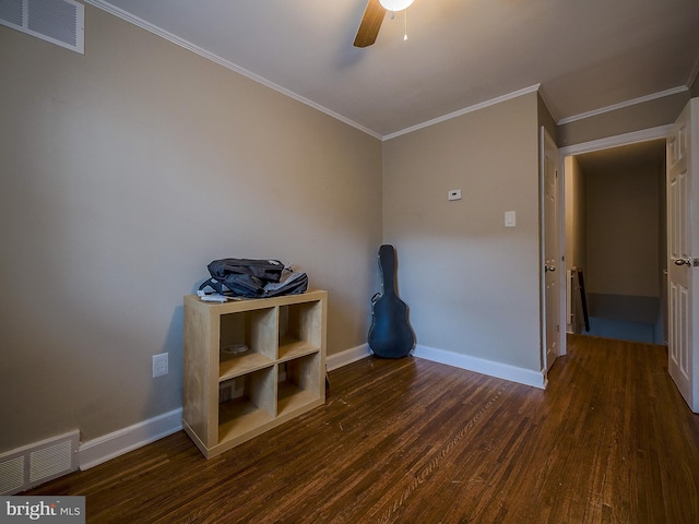 interior space featuring visible vents, baseboards, and wood finished floors