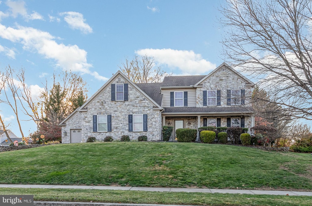 front facade with a front lawn