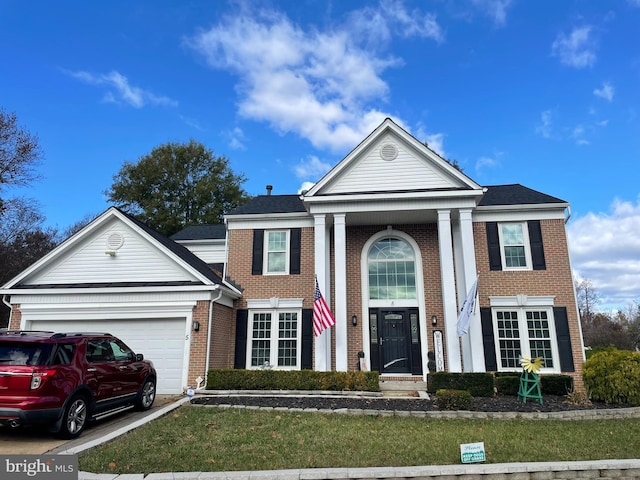 neoclassical home with a garage