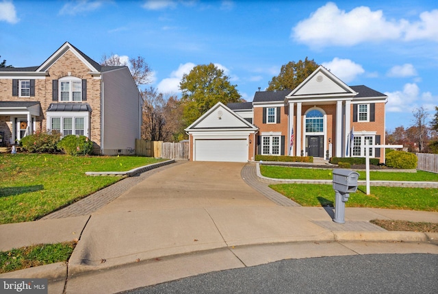 greek revival house featuring a garage and a front lawn