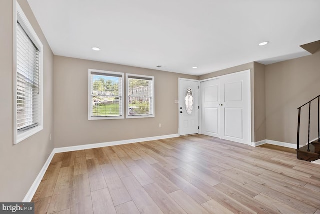 entryway featuring a wealth of natural light and light hardwood / wood-style flooring