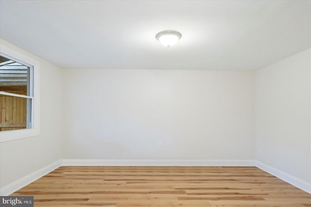 unfurnished room with light hardwood / wood-style flooring